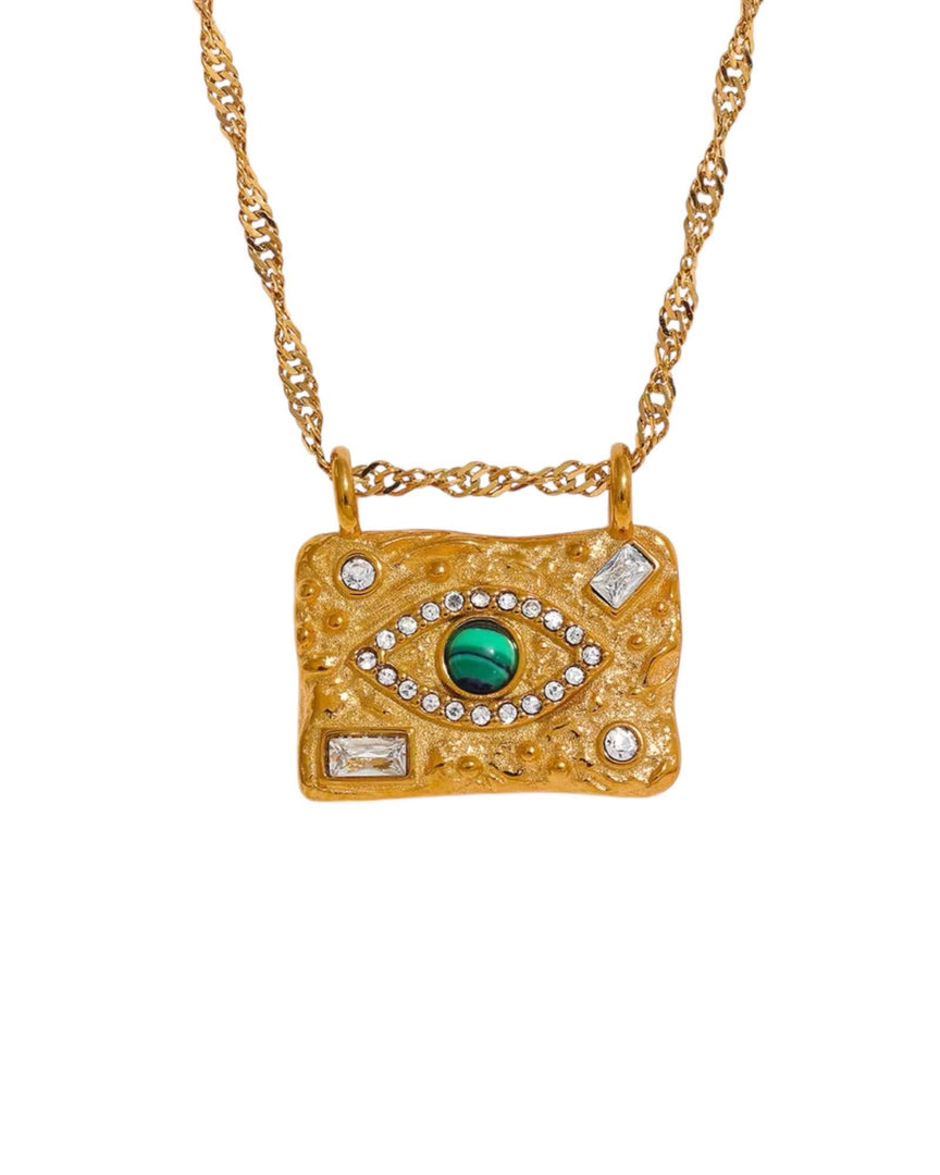 Celestial-inspired gold necklace featuring an intricate eye design with a green stone centerpiece and diamond accents on a textured rectangular pendant from Lia Haddi Modern Jewelry.