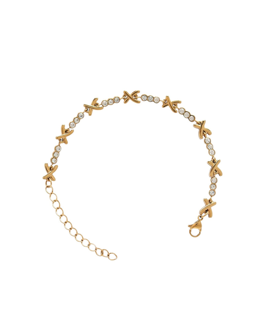 Criss Cross Sparkle Bracelet in polished gold, featuring elegant X-shaped links accented with shimmering crystals for a sophisticated sparkle. From Lia Haddi.