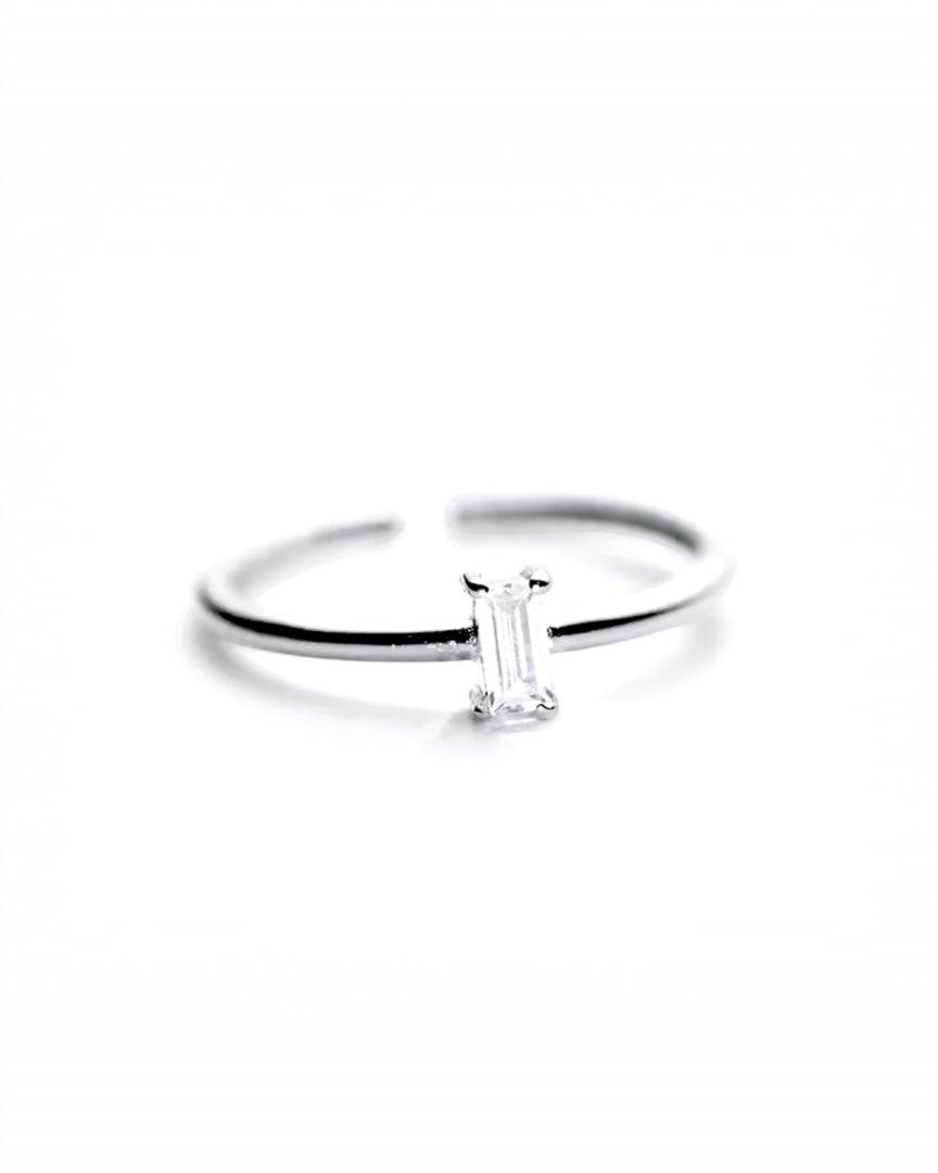 Dainty silver ring featuring an emerald-cut crystal, a minimalist and elegant accessory from Lia Haddi Jewelry.