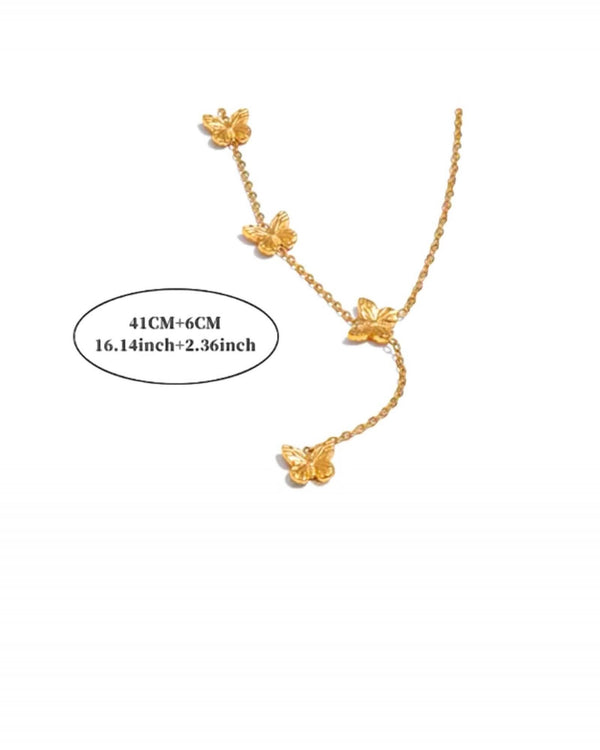 Elegant gold necklace adorned with fluttering butterfly pendants for a graceful and timeless look from Lia Haddi.