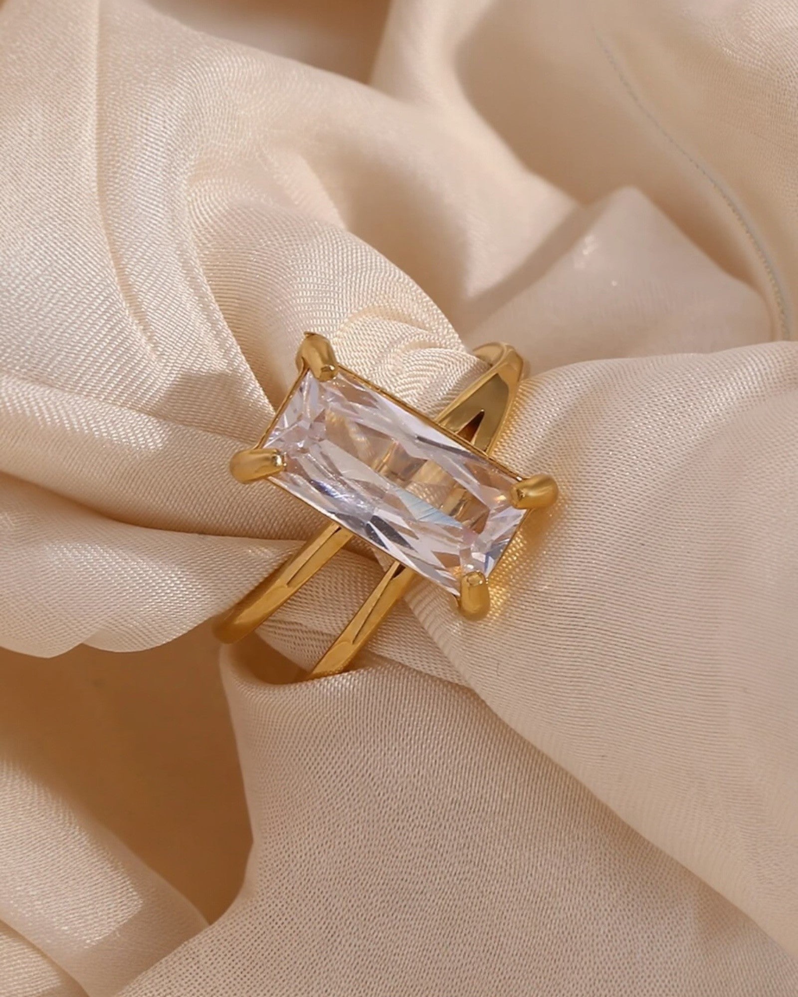 Gold geometric solitaire ring featuring a rectangular crystal centerpiece, a bold and modern design by Lia Haddi Modern Jewelry