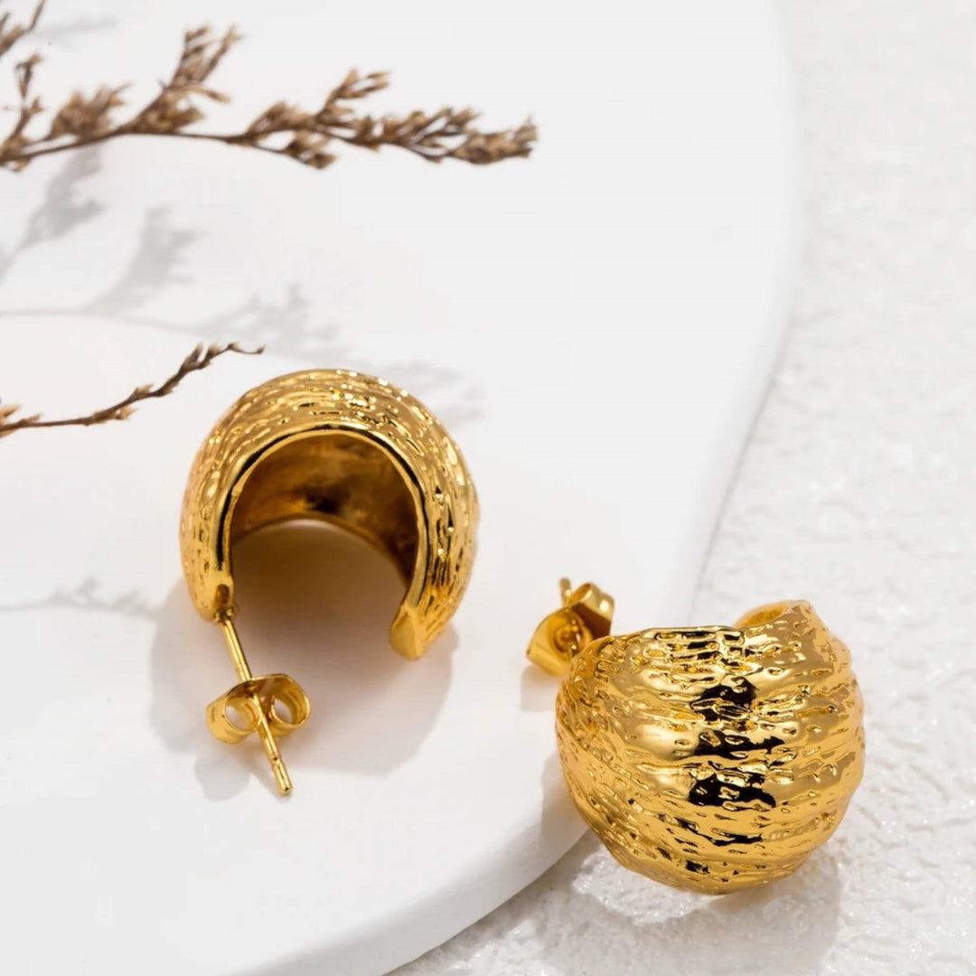 Golden Ridge Statement Earrings by Lia Haddi - 18K Gold Plated, Tarnish resistant, water-resistant, hypoallergenic, eco-friendly. Bold ridge design, perfect for making a statement on any occasion. Affordable luxury made from recycled materials