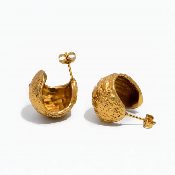 Golden Ridge Statement Earrings by Lia Haddi - 18K Gold Plated, Tarnish resistant, water-resistant, hypoallergenic, eco-friendly. Bold ridge design, perfect for making a statement on any occasion. Affordable luxury made from recycled materials