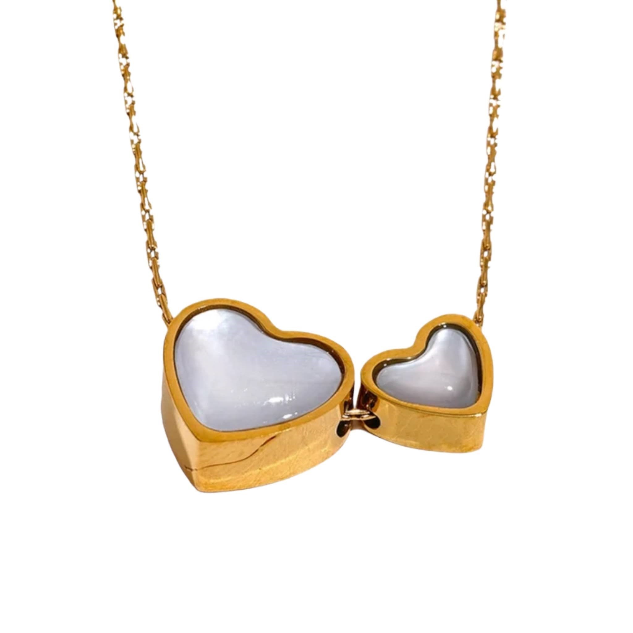 Infinite Love Pendant Necklace - Gold necklace with dual heart-shaped pendants featuring a lustrous inlay, symbolizing eternal love.