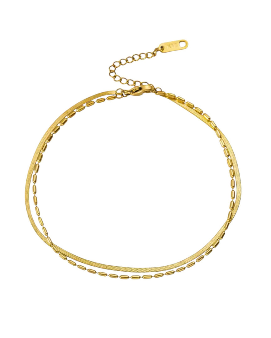 Layered Herringbone Bead Chain Bracelet in radiant gold, combining intricate beadwork with a sleek herringbone design for a contemporary layered look. From Lia Haddi.