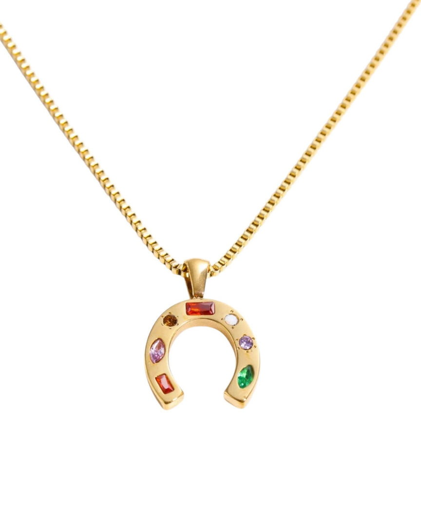 Gold horseshoe necklace adorned with colorful gemstones, symbolizing luck and elegance, perfect for any occasion.