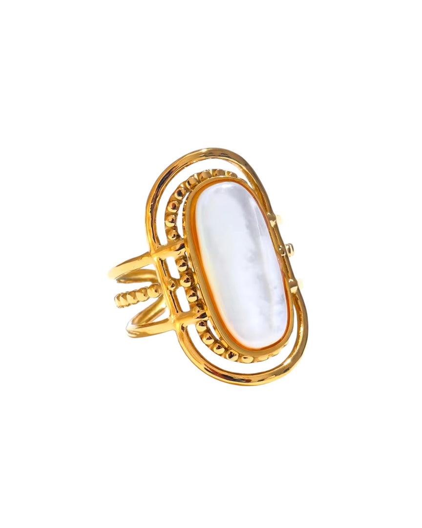 Gold oval statement ring with a luminous mother-of-pearl centerpiece, an elegant and bold design by Lia Haddi Modern Jewelry.