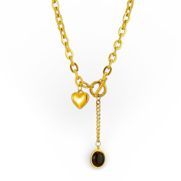 Gold toggle necklace with heart charm and black resin oval drop pendant in 18K gold plated stainless steel