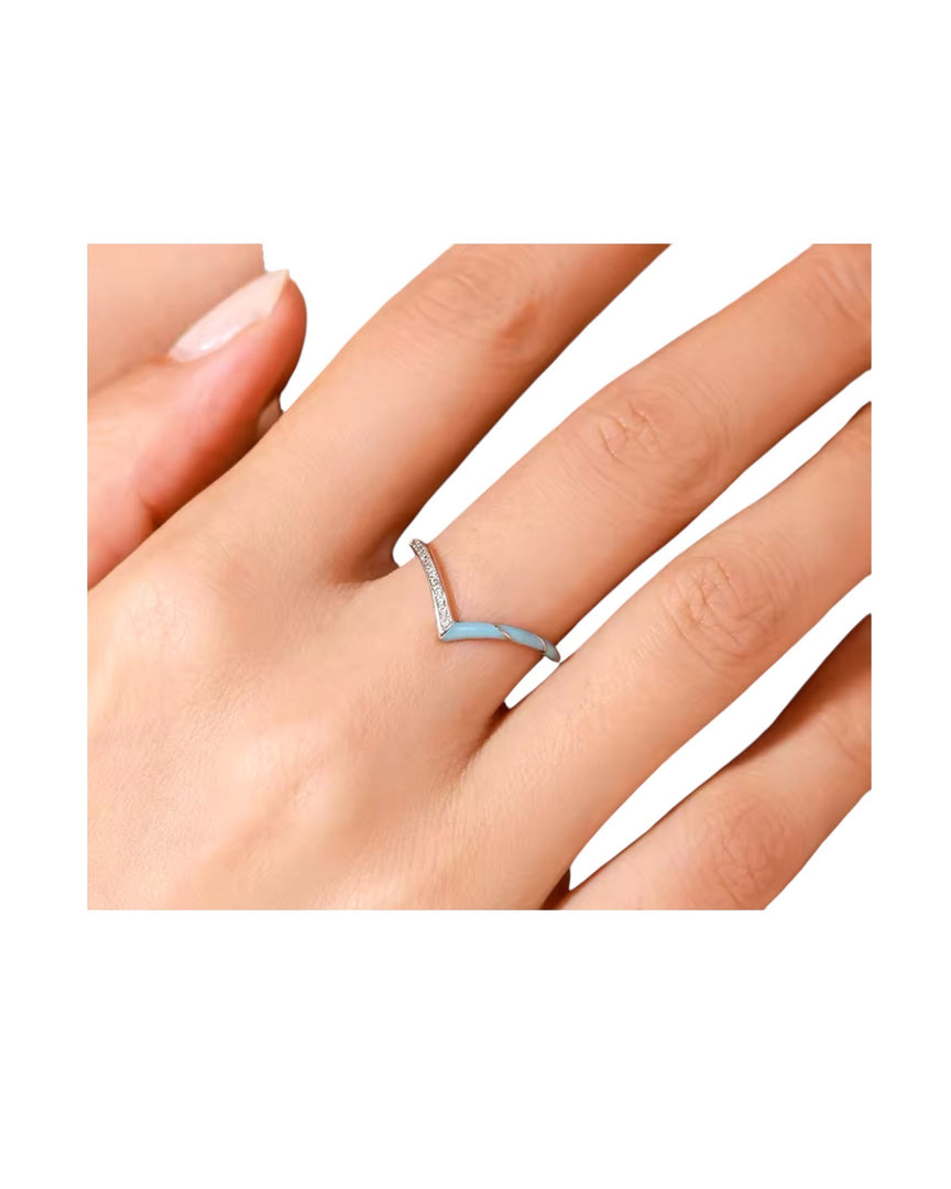 Elegant silver curve ring with a sleek V-shape design and sparkling pave crystals, offering modern simplicity by Lia Haddi Modern Jewelry.