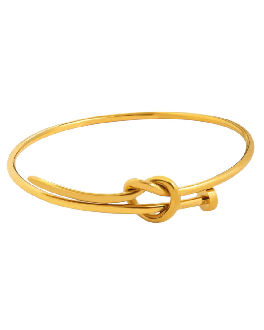 Timeless Knot Bracelet in polished gold, featuring a minimalist knot design symbolizing elegance and unity. From Lia Haddi.