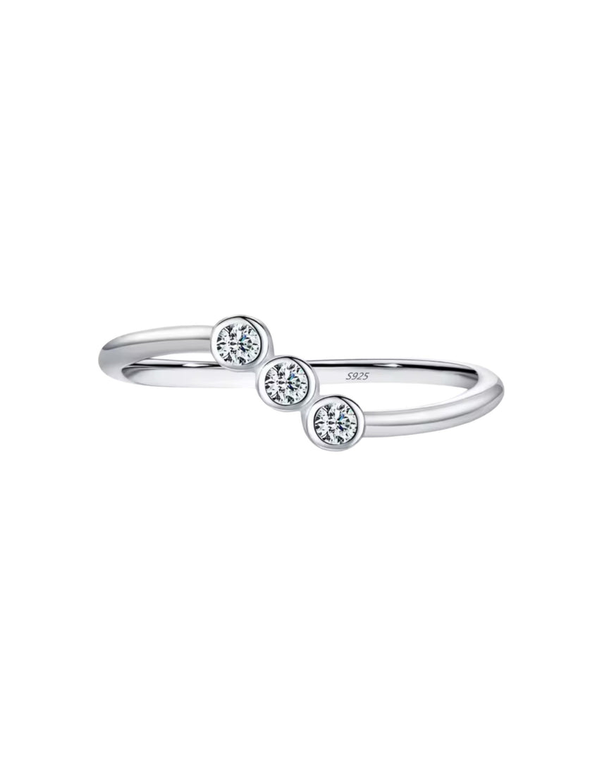 Delicate silver ring with three bezel-set sparkling crystals, a timeless and elegant accessory from Lia Haddi Jewelry.