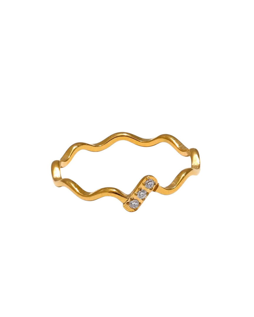 Gold wave-shaped ring with a unique design featuring three sparkling crystals, a chic and modern piece by Lia Haddi Modern Jewelry.