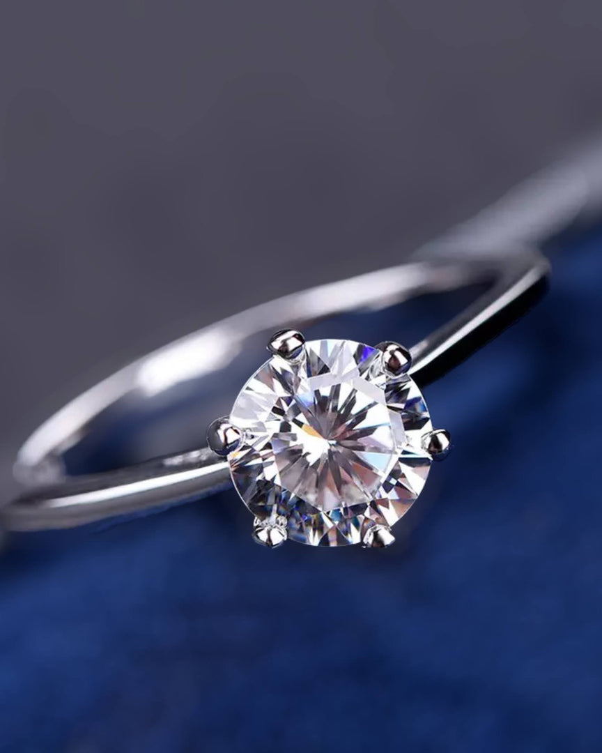 Dalina Engagement Ring by Lia Haddi - S925 Metal Base with AU750/GF 18K Gold Filled, Tarnish resistant, water-resistant, hypoallergenic, featuring a 2 carat Round Heart & Arrow Moissanite VVS1 stone in a six prong cathedral setting. Solitaire design