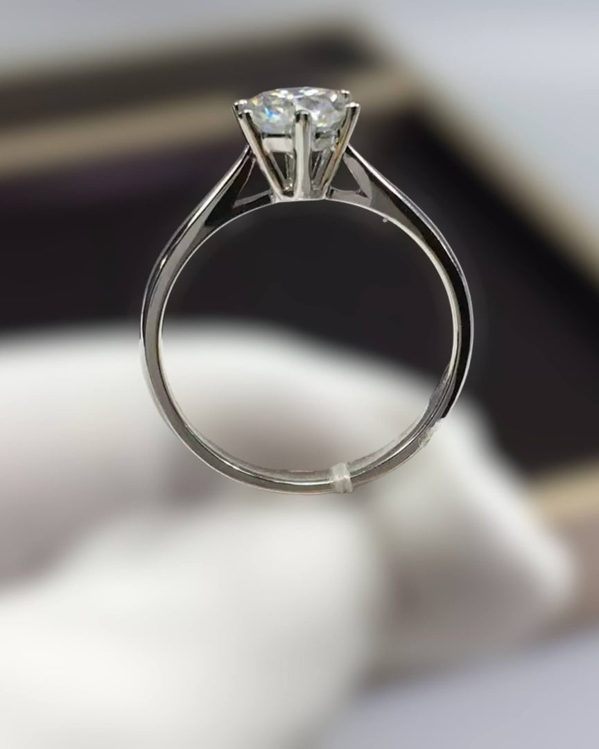 Dalina Engagement Ring by Lia Haddi - S925 Metal Base with AU750/GF 18K Gold Filled, Tarnish resistant, water-resistant, hypoallergenic, featuring a 3 carat Round Heart & Arrow Moissanite VVS1 stone in a six prong cathedral setting. Solitaire design.