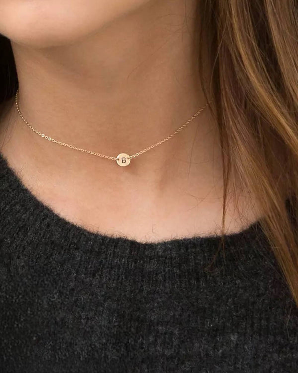 Lia Haddi Initial Disc Pendant Necklace - Stainless Steel, 14K Yellow Gold Plated, 35cm + 3cm Length, 6mm Pendant, Tarnish Resistant, Water-Resistant, Hypoallergenic, Initial letters available: A, C, Q, Z. Trendy and fashionable design from Lia Haddi's collection.