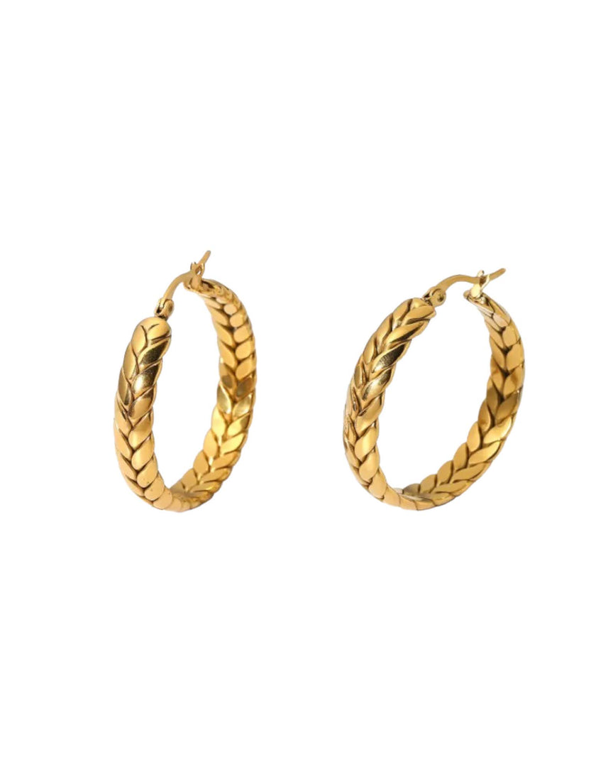 Gold Herringbone Hoop Earrings with intricate braided design, offering a bold yet elegant look. From Lia Haddi.