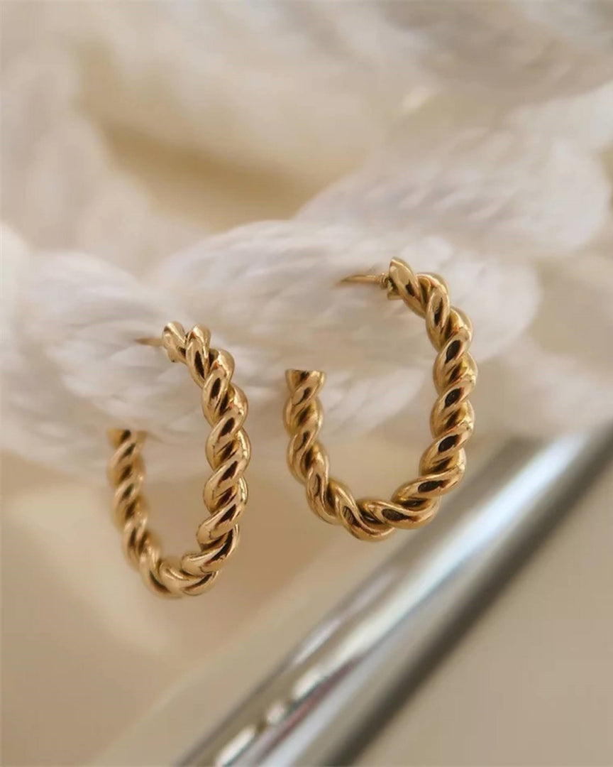 Lia Haddi Twist Hoop Earring - Stainless Steel, 14K Yellow Gold Plated, 40mm Size, 4mm Width, Tarnish Resistant, Water-Resistant, Hypoallergenic, Recycled materials, Trendy and fashionable design from Lia Haddi's collection.