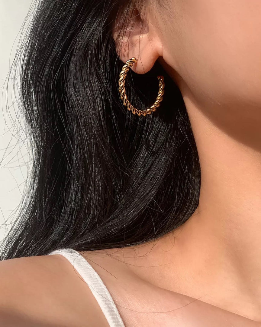 Lia Haddi Twist Hoop Earring - Stainless Steel, 14K Yellow Gold Plated, 40mm Size, 4mm Width, Tarnish Resistant, Water-Resistant, Hypoallergenic, Recycled materials, Trendy and fashionable design from Lia Haddi's collection.